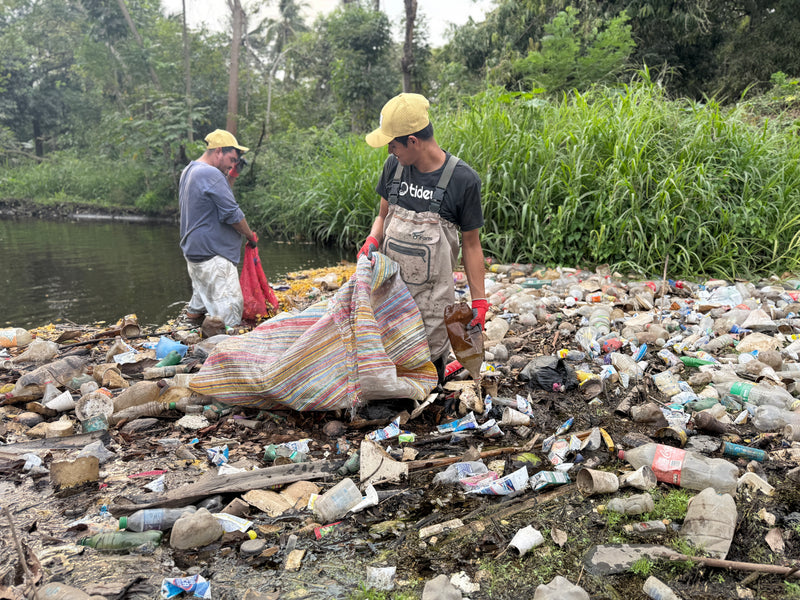 Man from Tidey Oceans picking up trash on the beach