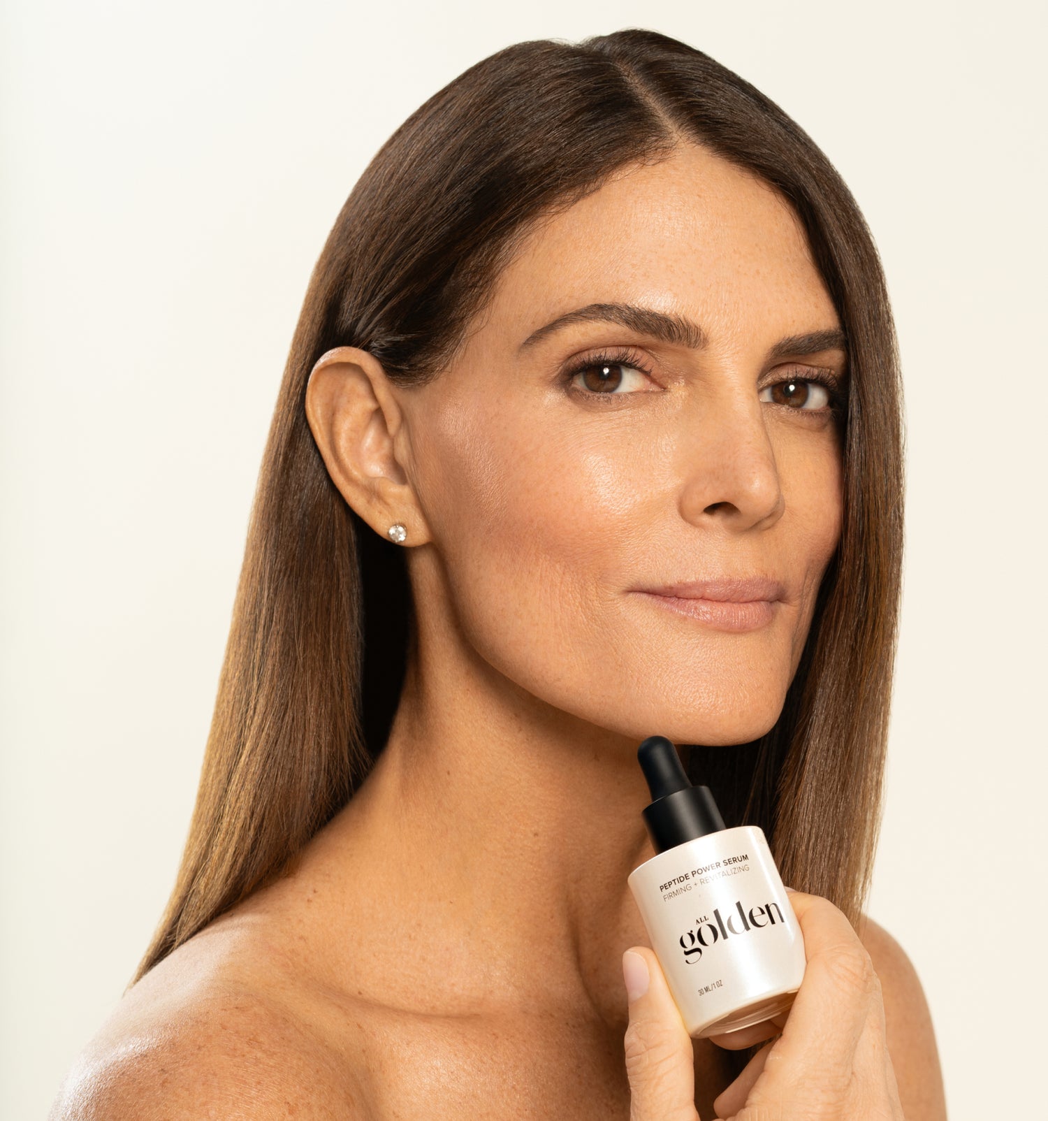 Woman holding Peptide Power Serum