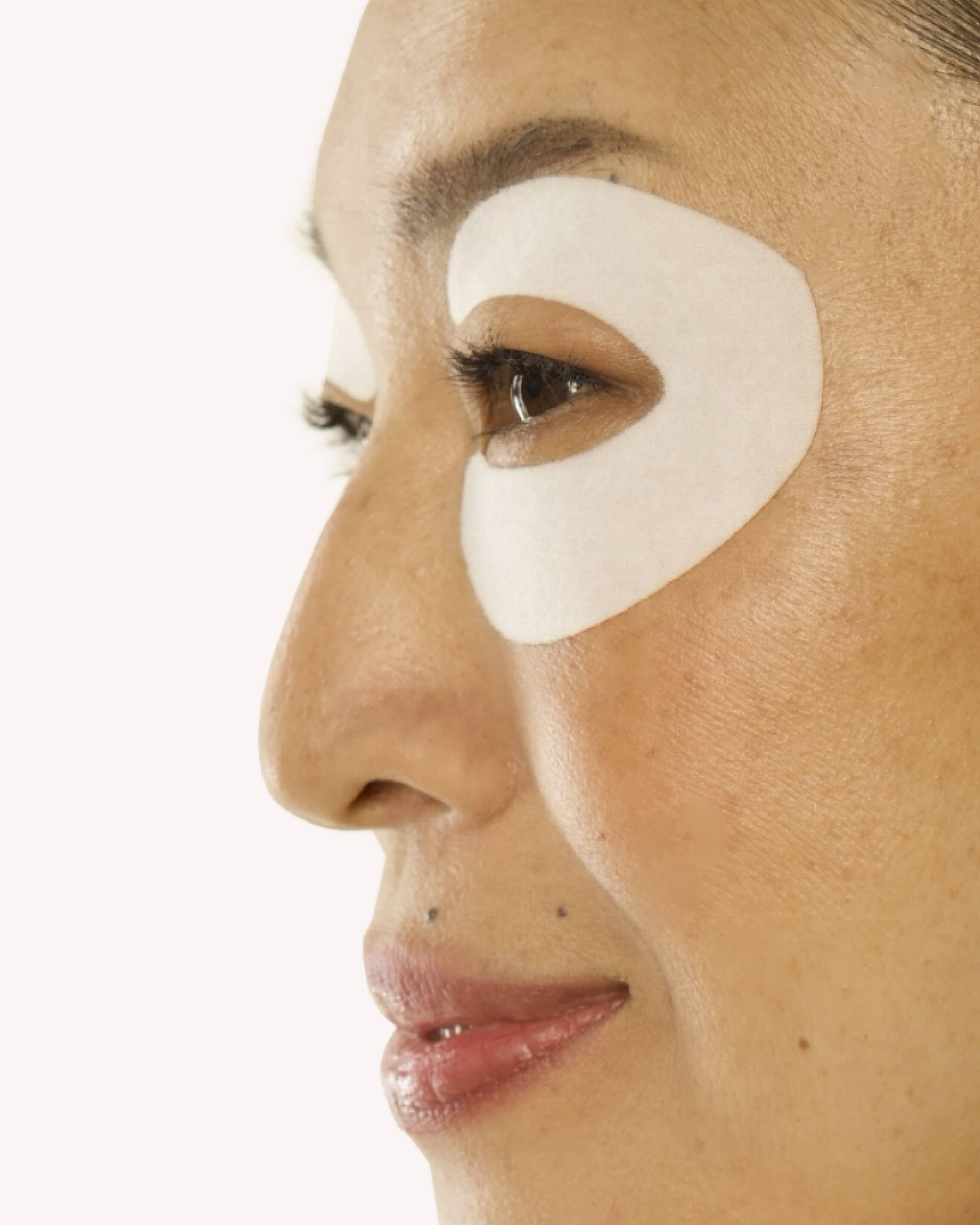 Woman wearing 360 eye patches