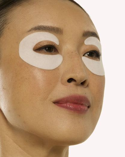 woman wearing eye patches